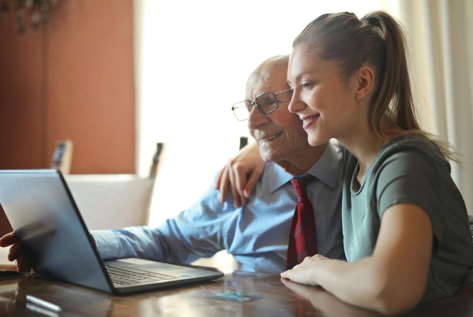 One helping another with their computer